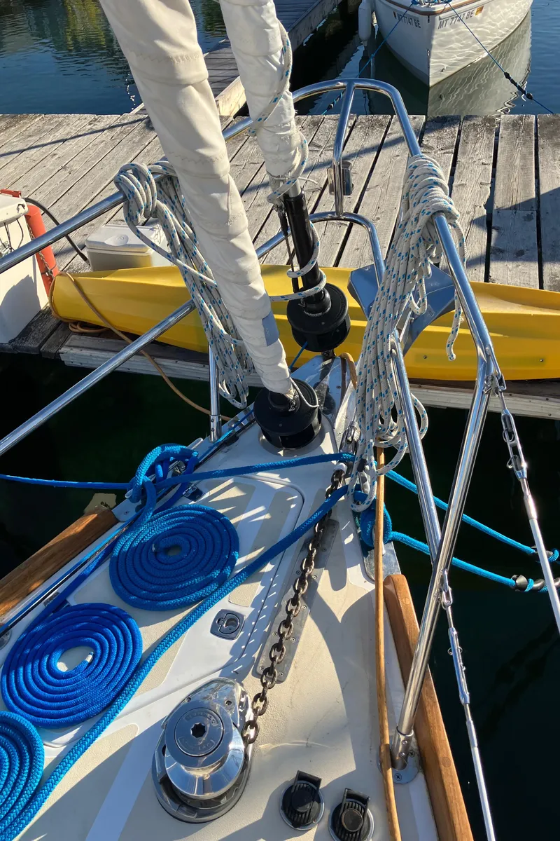 Slide: The Image of Bow of 2007 Tartan 3400 sailboat with ropes and docked at marina. - 13