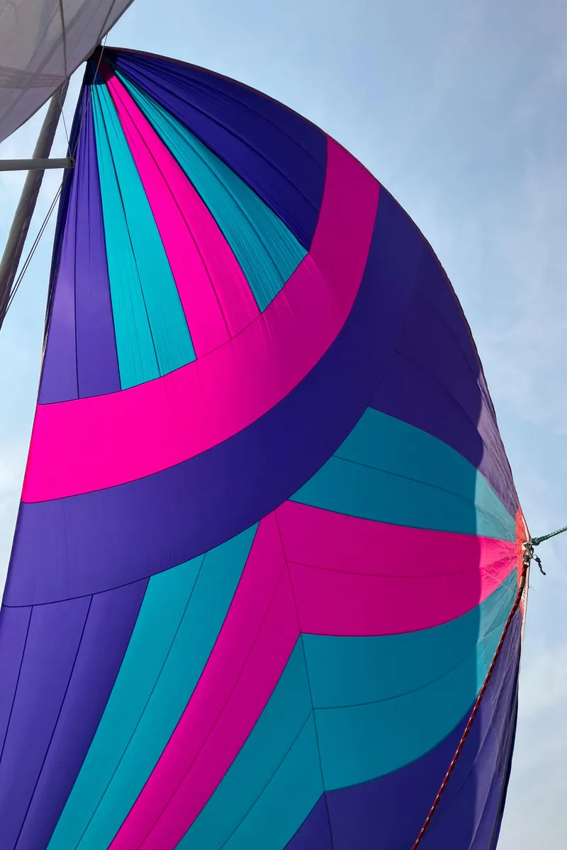 Slide: The Image of Colorful sail of a 2007 Tartan 3400 yacht against a clear sky. - 20