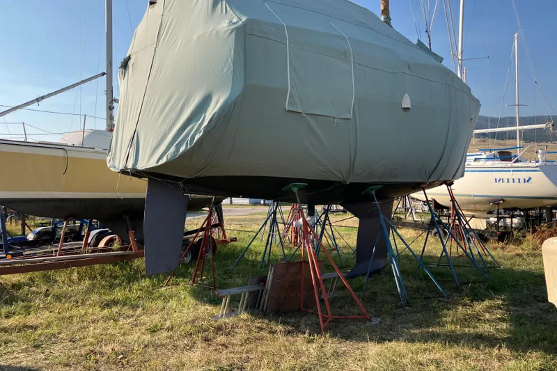 Slide: The Image of Covered 2007 Tartan 3400 sailboat on stands in a boatyard. - 23