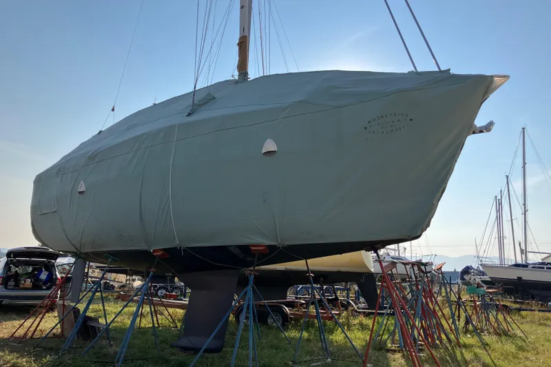 Slide: The Image of 2007 Tartan 3400 sailboat covered and supported on stands in a boatyard. - 24