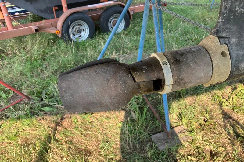 Slide: The Image of Close-up of a 2007 Tartan 3400 sailboat propeller on grass. - 30