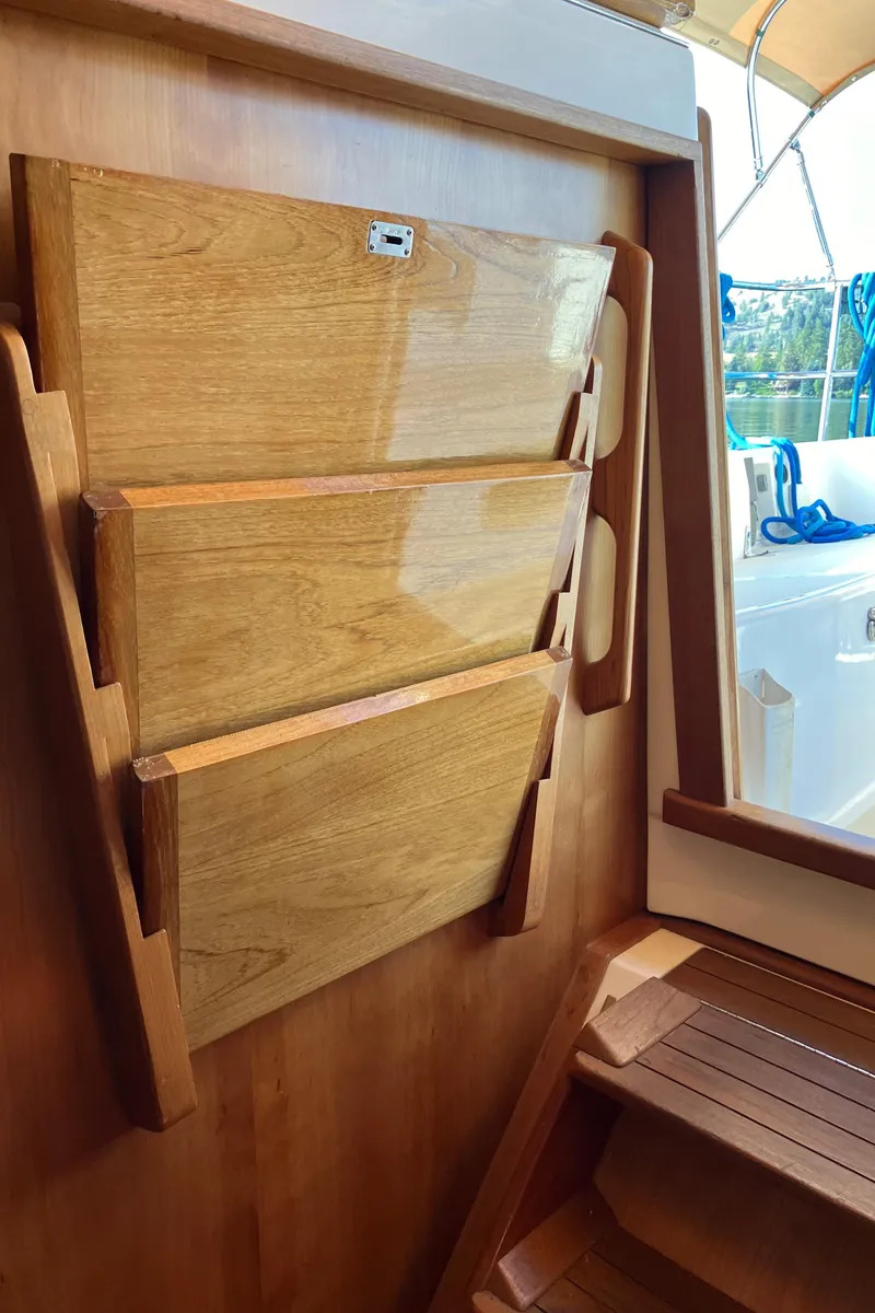 Slide: The Image of Wooden interior of a 2007 Tartan 3400 sailboat with foldable table and steps. - 44