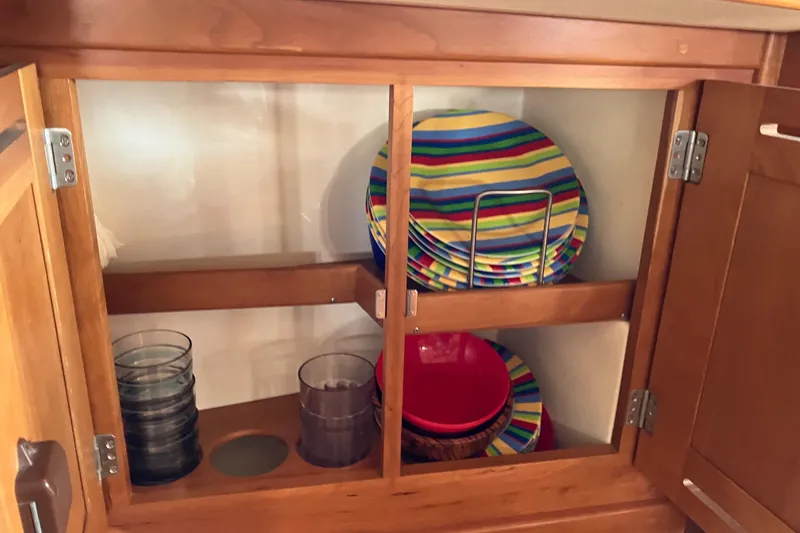 Slide: The Image of Wooden cabinet with colorful striped plates and glasses, Tartan 3400, 2007 model. - 47