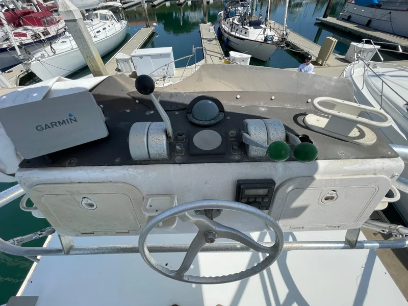 Slide: The Image of Control panel of a 1997 Cabo 31 Express boat with Garmin navigation system. - 15