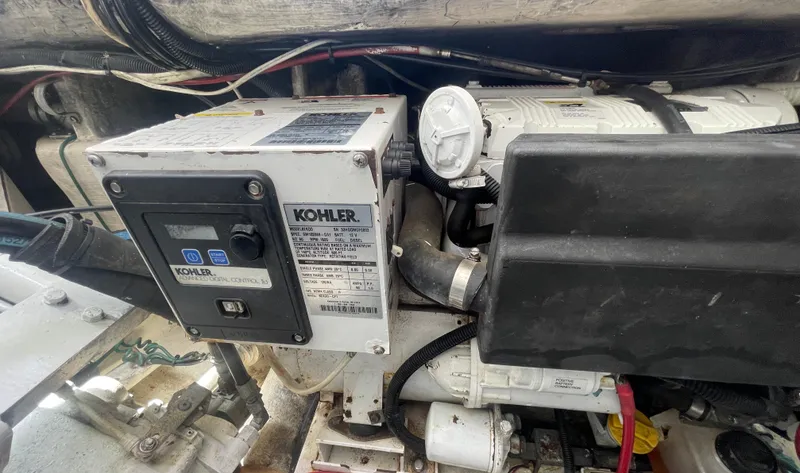 Slide: The Image of Kohler generator in a 1997 Cabo 31 Express boat engine compartment. - 35