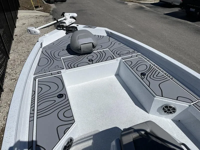 Slide: The Image of 2025 Xpress H22B boat deck with modern design and storage compartments. - 4