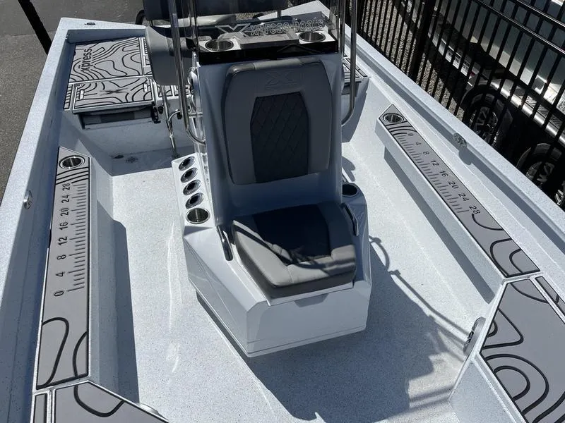 Slide: The Image of 2025 Xpress H22B boat interior with seating and measurement guides. - 8
