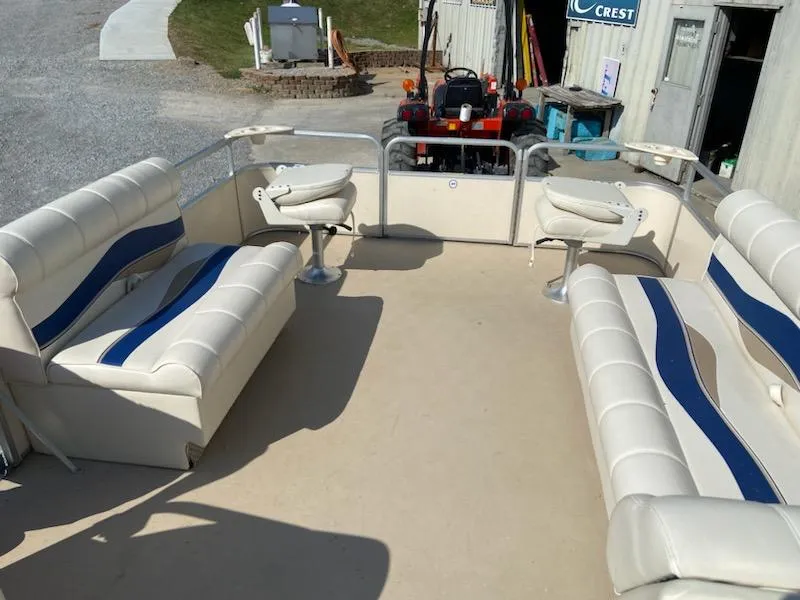 Slide: The Image of 2008 Godfrey Sweetwater SWT 2486 FC pontoon boat interior with white and blue seating. - 7