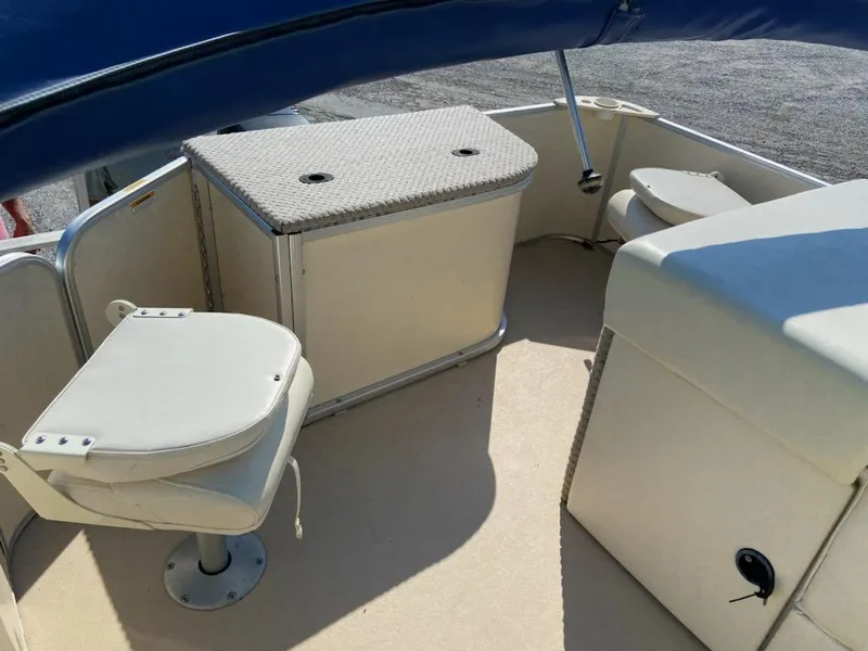 Slide: The Image of 2008 Godfrey Sweetwater SWT 2486 FC boat interior with seating and storage. - 8
