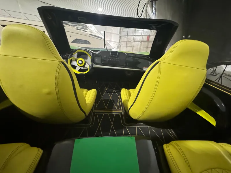Slide: The Image of Interior of 2023 Watersports Car Series B with vibrant yellow seats and modern dashboard. - 10