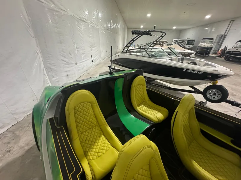 Slide: The Image of 2023 Watersports Car Series B with vibrant yellow seats in a showroom. - 6