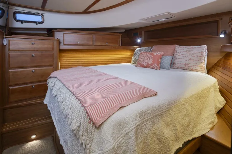 Slide: The Image of Luxurious bedroom interior of 2018 Sabre 45 Salon Express yacht with cozy bedding. - 10