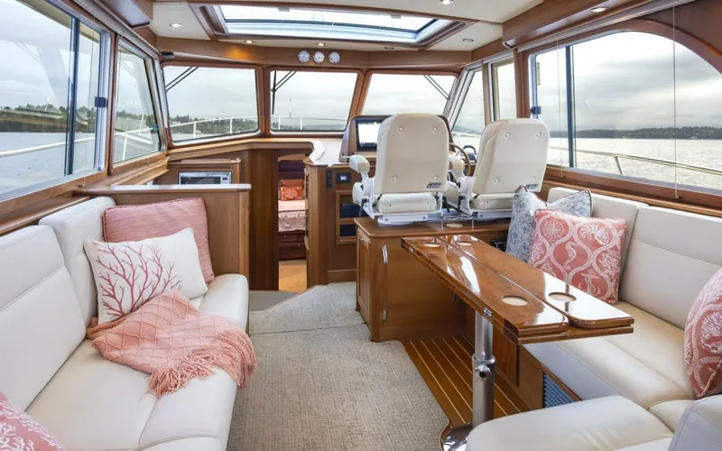 Slide: The Image of Luxurious interior of 2018 Sabre 45 Salon Express yacht with elegant seating and wooden finishes. - 18