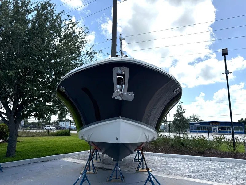 Slide: The Image of 2014 Chris-Craft Catalina 29 boat on stands, viewed from the front, outdoors. - 3