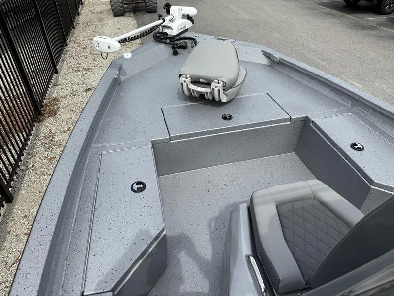 Slide: The Image of 2025 Xpress H20B boat interior with seating and trolling motor. - 7