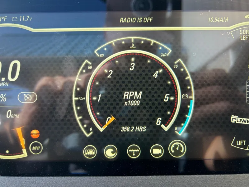 Slide: The Image of Dashboard of 2021 Malibu Wakesetter 24 MXZ showing RPM and other metrics. - 12
