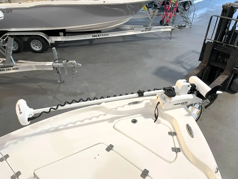Slide: The Image of 2024 Key West 210 Bay Reef boat with trolling motor in a showroom. - 16