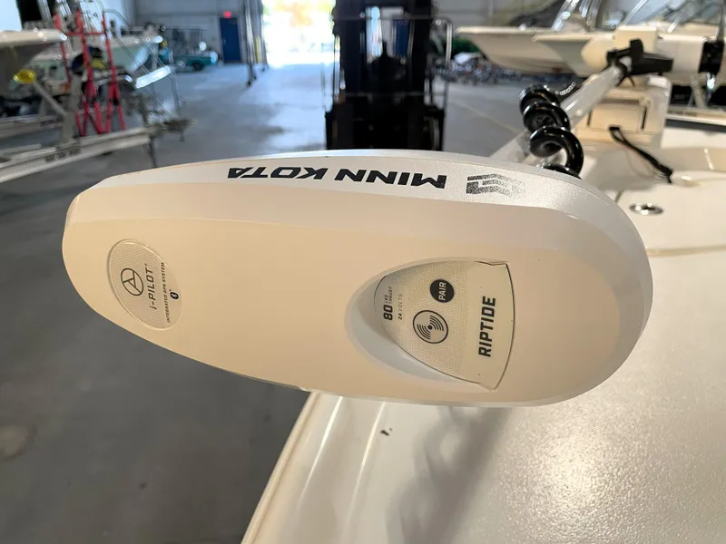 Slide: The Image of Minn Kota Riptide motor on 2024 Key West 210 Bay Reef boat in a garage. - 18