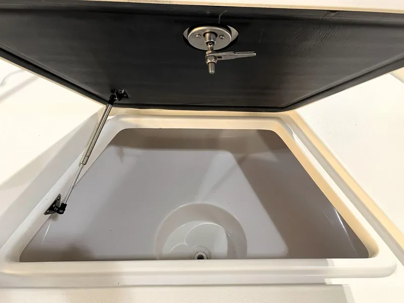 Slide: The Image of Open storage compartment on 2024 Key West 210 Bay Reef boat. - 19