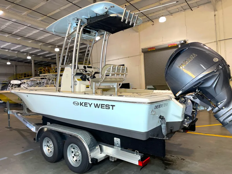 Slide: The Image of 2024 Key West 210 Bay Reef boat on trailer in indoor storage facility. - 2