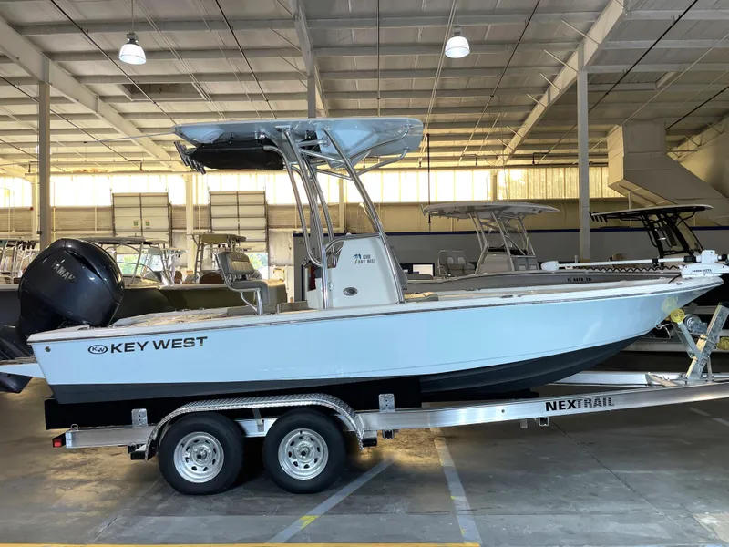 Slide: The Image of 2024 Key West 210 Bay Reef boat on trailer in indoor showroom. - 3