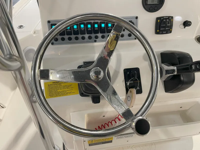 Slide: The Image of 2024 Key West 210 Bay Reef boat steering wheel and control panel. - 34
