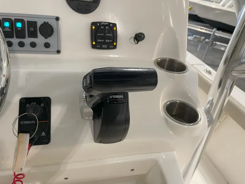 Slide: The Image of 2024 Key West 210 Bay Reef boat console with Yamaha controls and cup holders. - 35