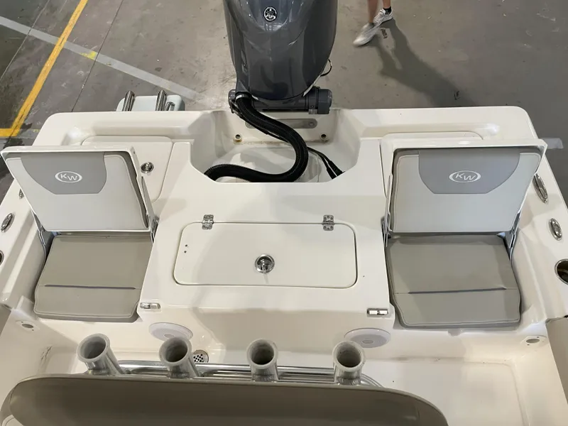 Slide: The Image of 2024 Key West 210 Bay Reef boat interior with seating and storage compartments. - 37