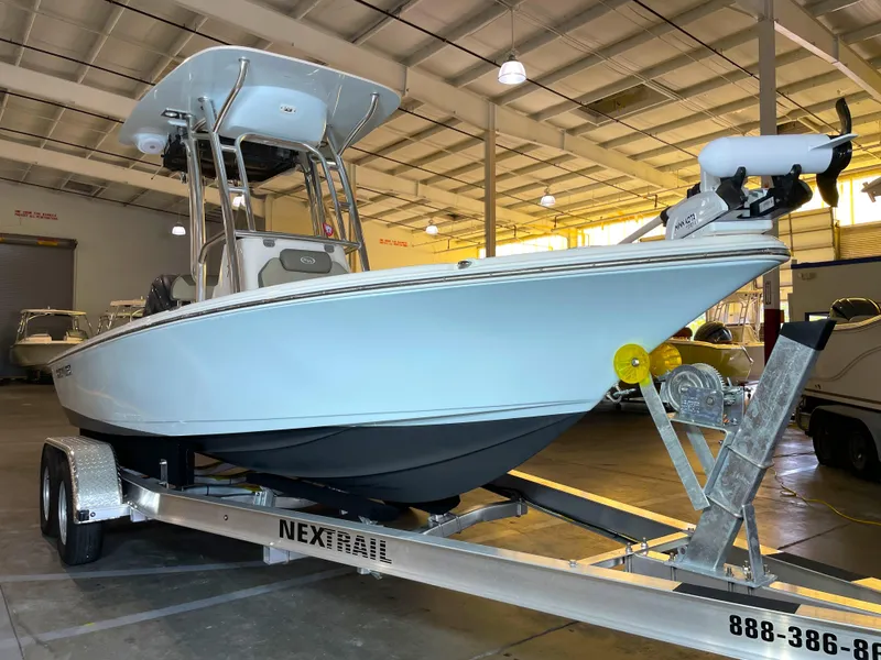 Slide: The Image of 2024 Key West 210 Bay Reef boat on trailer in indoor showroom. - 4