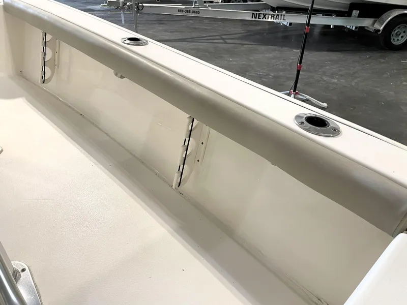 Slide: The Image of 2024 Key West 210 Bay Reef boat interior with rod holders and clean white finish. - 42