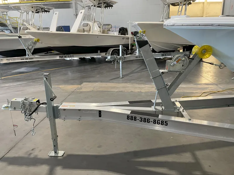 Slide: The Image of 2024 Key West 210 Bay Reef boat on trailer in indoor storage facility. - 45