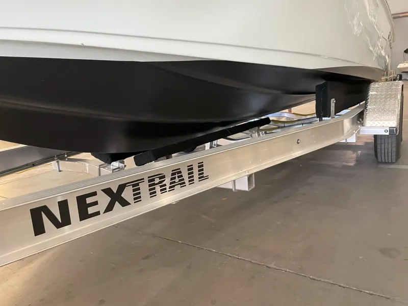 Slide: The Image of 2024 Key West 210 Bay Reef boat on NexTrail trailer, close-up view. - 46