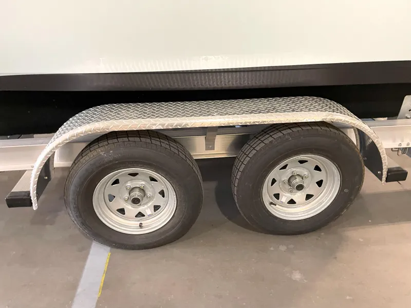 Slide: The Image of Trailer wheels of a 2024 Key West 210 Bay Reef boat. - 47