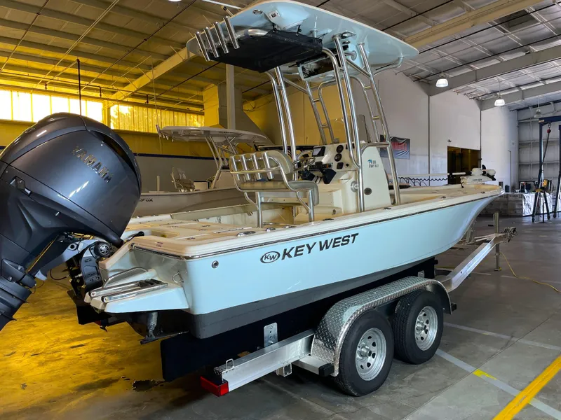 Slide: The Image of 2024 Key West 210 Bay Reef boat on trailer in indoor storage. - 5