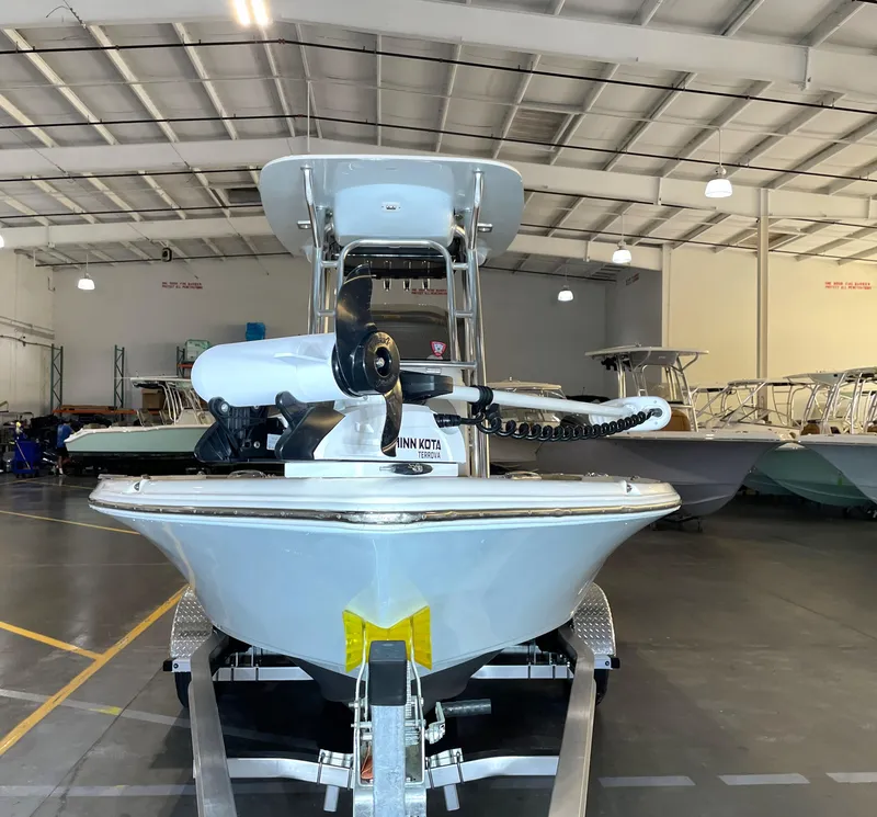 Slide: The Image of 2024 Key West 210 Bay Reef boat in showroom, featuring Minn Kota Terrova motor. - 6