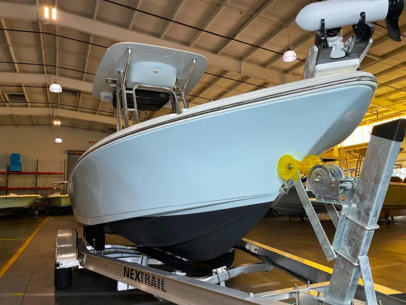 Slide: The Image of 2024 Key West 210 Bay Reef boat on trailer in indoor storage facility. - 8