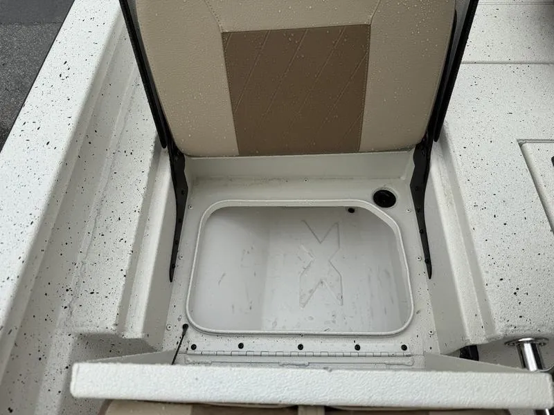 Slide: The Image of 2025 Xpress H20B boat storage compartment with open seat, showcasing interior design. - 12