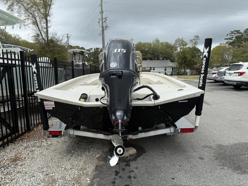 Slide: The Image of 2025 Xpress H20B boat on trailer, rear view with 115 horsepower engine. - 5