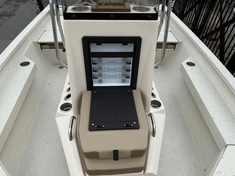 Slide: The Image of 2025 Xpress H20B boat interior with storage compartments and cup holders. - 9