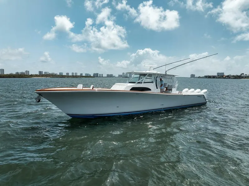 Slide: The Image of 2024 Front Runner 47 Center Console boat on water under blue sky. - 10