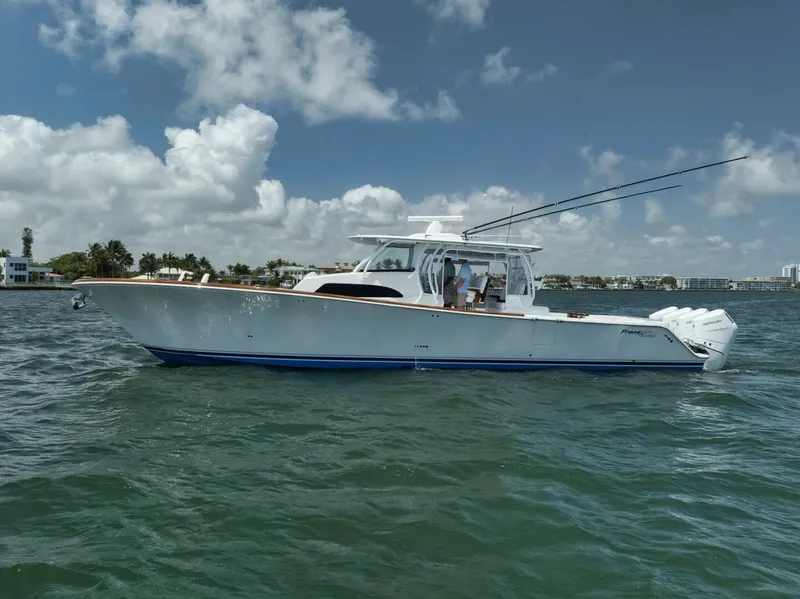 Slide: The Image of 2024 Front Runner 47 Center Console boat on water under blue sky. - 11