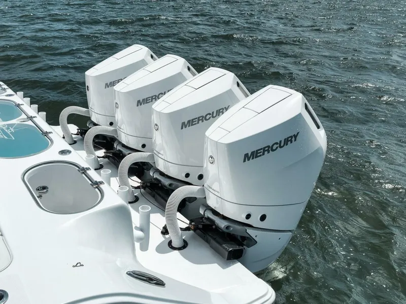 Slide: The Image of 2024 Front Runner 47 Center Console with four Mercury outboard engines on the water. - 13