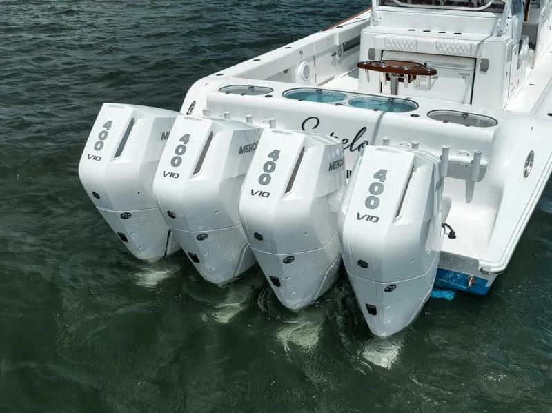 Slide: The Image of 2024 Front Runner 47 Center Console with four powerful Mercury V10 outboard engines. - 15