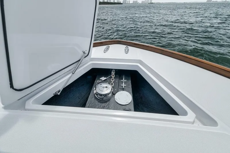 Slide: The Image of 2024 Front Runner 47 Center Console anchor compartment with open hatch, ocean view. - 16