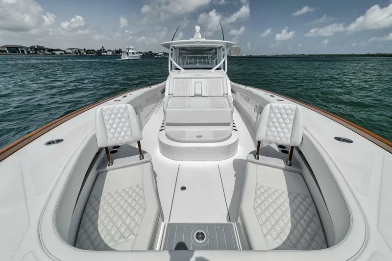 Slide: The Image of 2024 Front Runner 47 Center Console boat with luxurious seating on open water. - 17