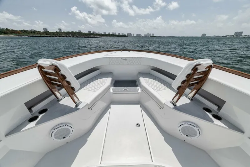 Slide: The Image of 2024 Front Runner 47 Center Console boat with spacious seating and ocean view. - 19