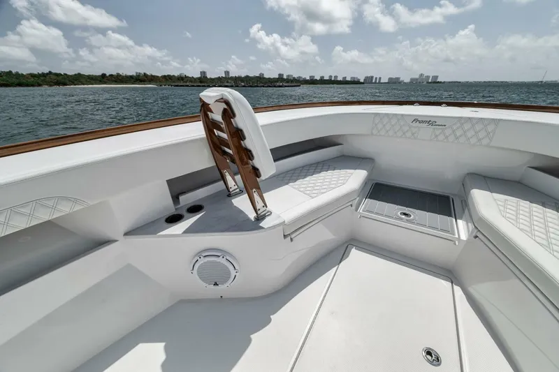 Slide: The Image of 2024 Front Runner 47 Center Console boat interior with seating and ocean view. - 21