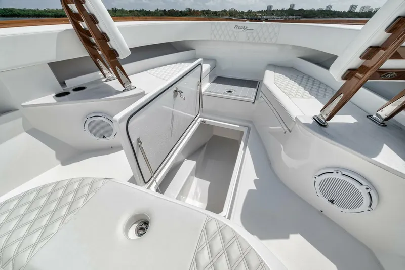 Slide: The Image of 2024 Front Runner 47 Center Console boat interior with storage and seating. - 22
