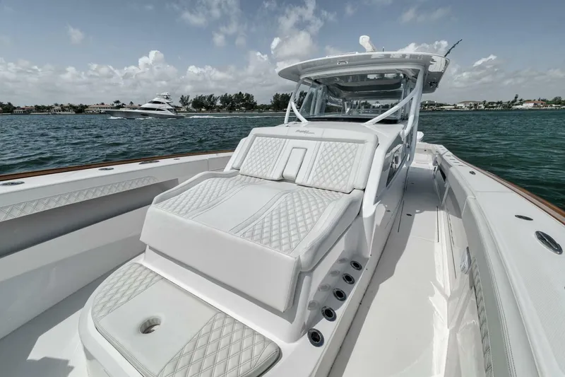 Slide: The Image of 2024 Front Runner 47 Center Console boat with luxurious seating on open water. - 23