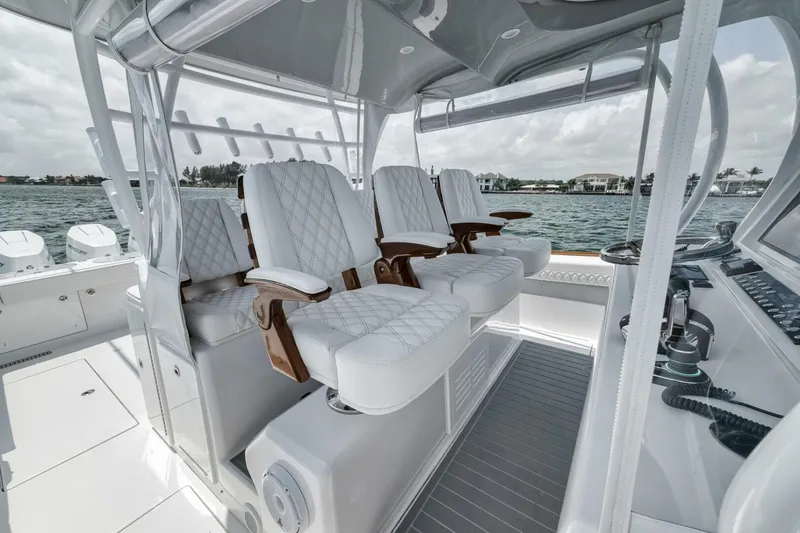 Slide: The Image of Luxurious seating on 2024 Front Runner 47 Center Console boat, featuring elegant white upholstery. - 27